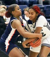 WHC Lemoore's Inani Madden battles for a loose ball in the fourth quarter against College of the Sequoias. 